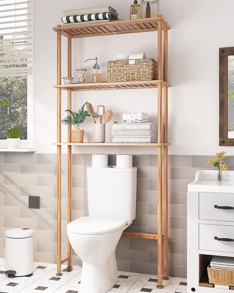 Natural bamboo storage rack placed over a toilet in a bathroom