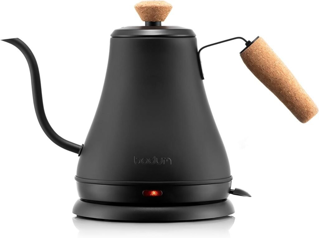 Matte black gooseneck kettle with wooden handle, ideal for pour-over coffee
