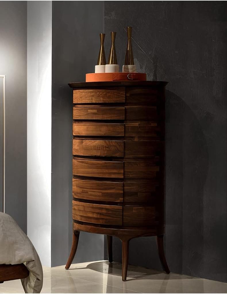 Tall circular wooden cabinet with stacked drawers against dark wall