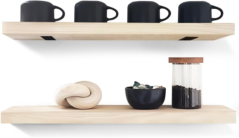 Light wood floating kitchen shelves holding mugs and decor