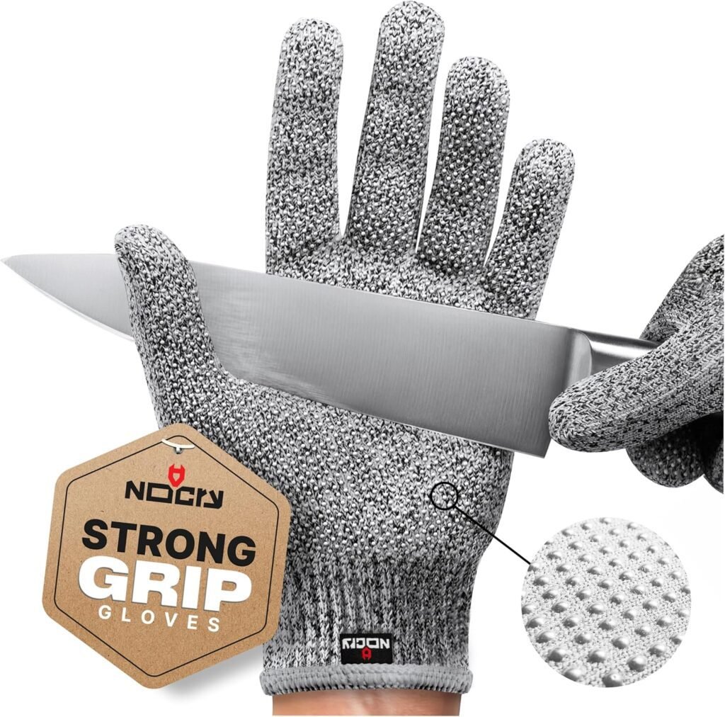 Safety gloves holding a wood chisel tool