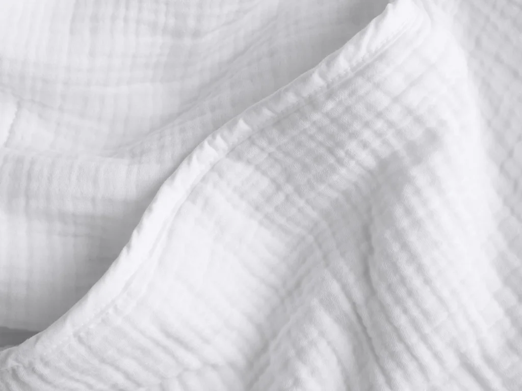 Soft white quilt with cloud-like texture