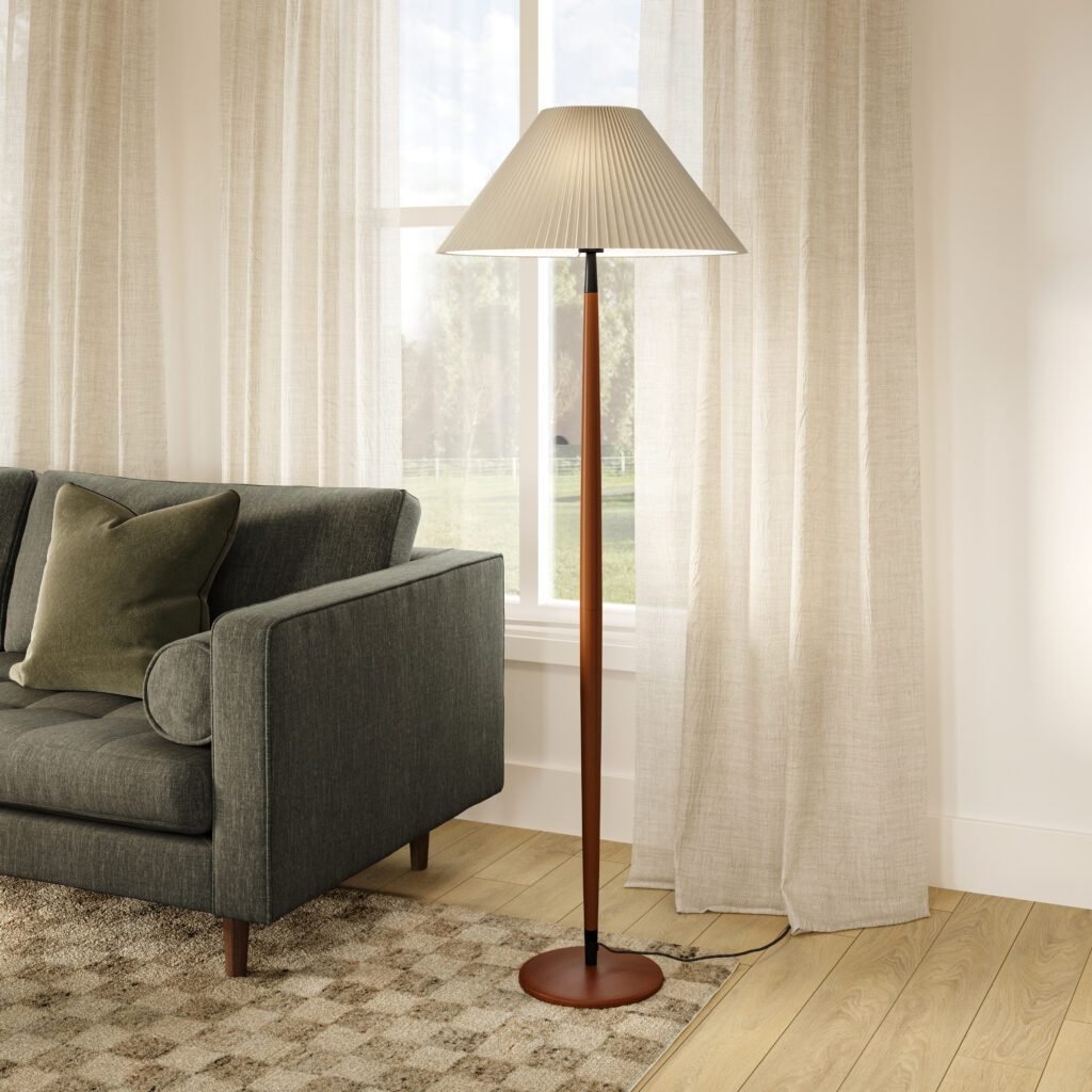 Tall walnut floor lamp beside armchair with soft drapes