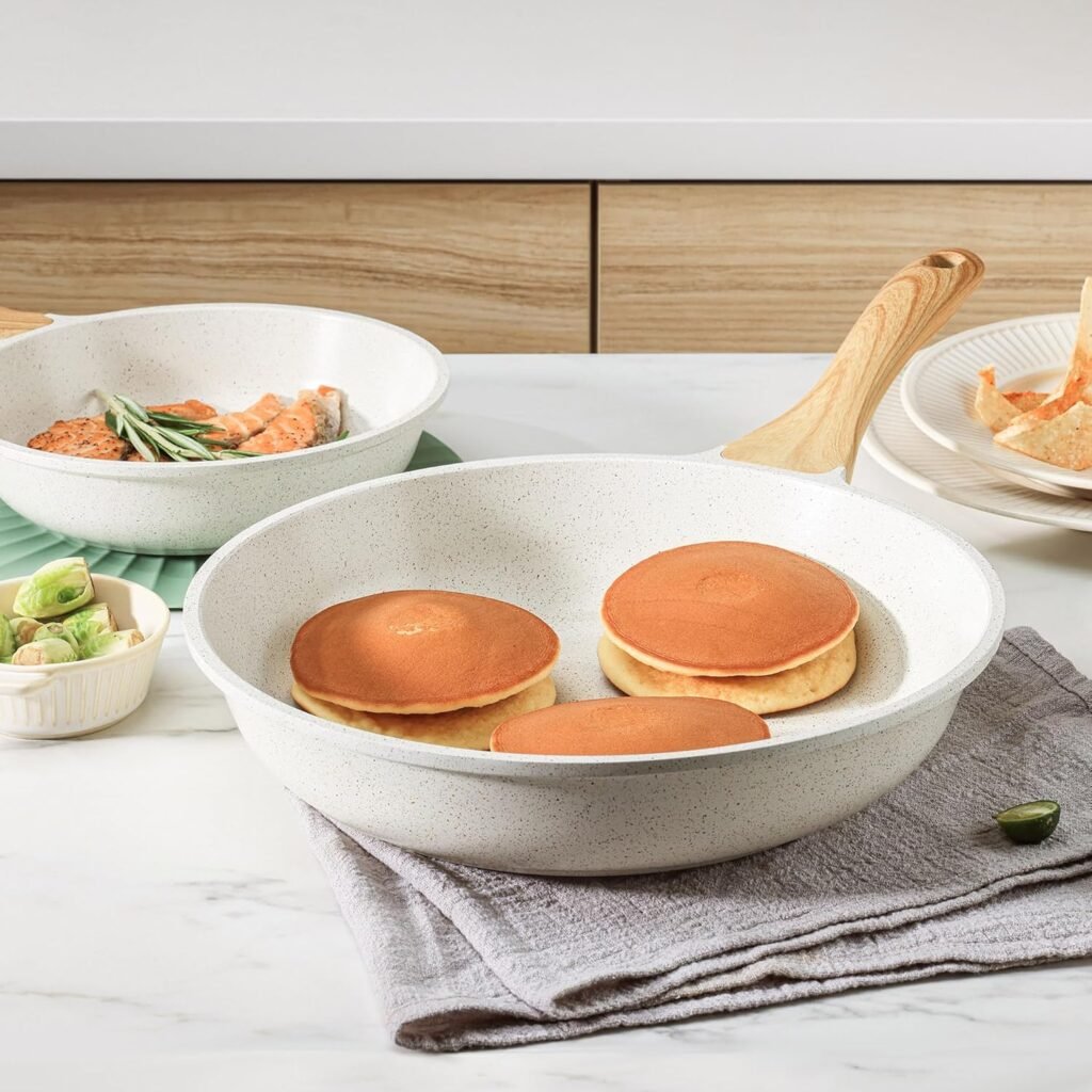 White ceramic skillet with eggs, wooden handle visible