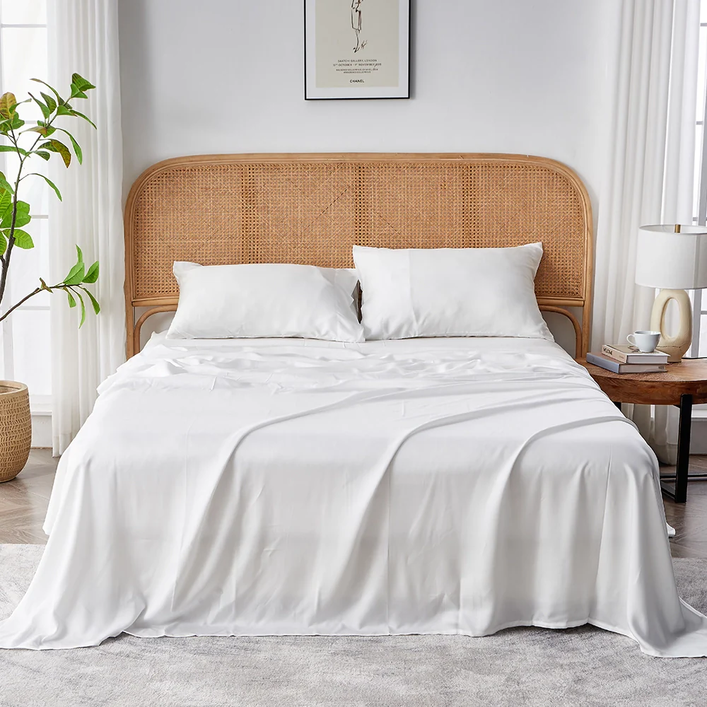 Eucalyptus Tencel sheet set on a cozy bed, styled with neutral tones for a luxurious look.