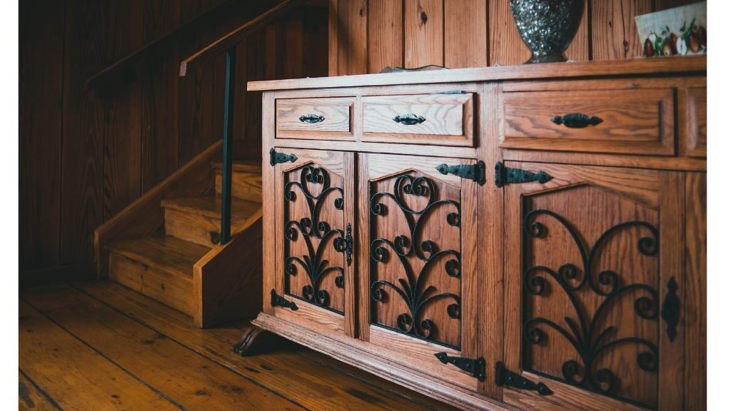 Dark wood sideboard cabinet with floral carvings