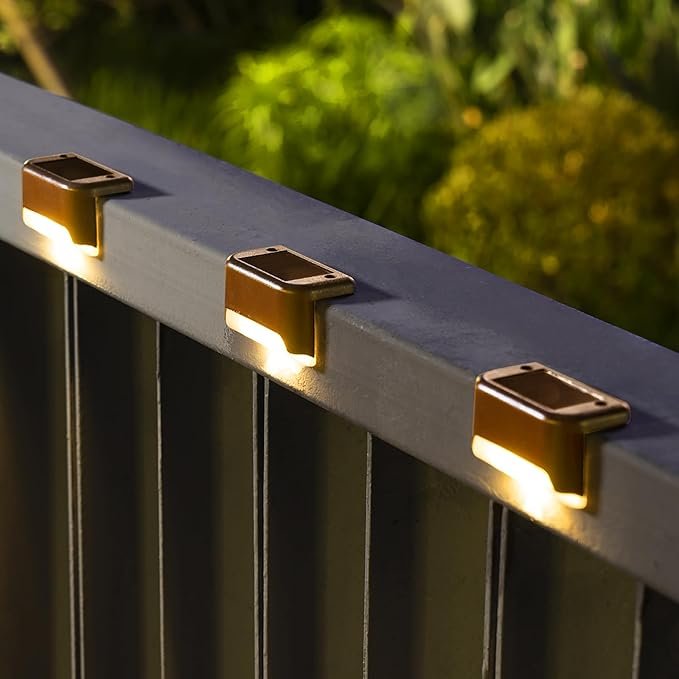 Gold-hued solar lights installed on a deck railing