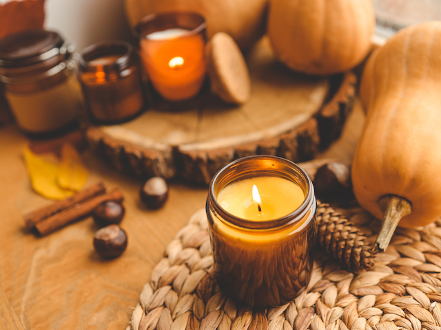 Candle with pumpkins and fall decor