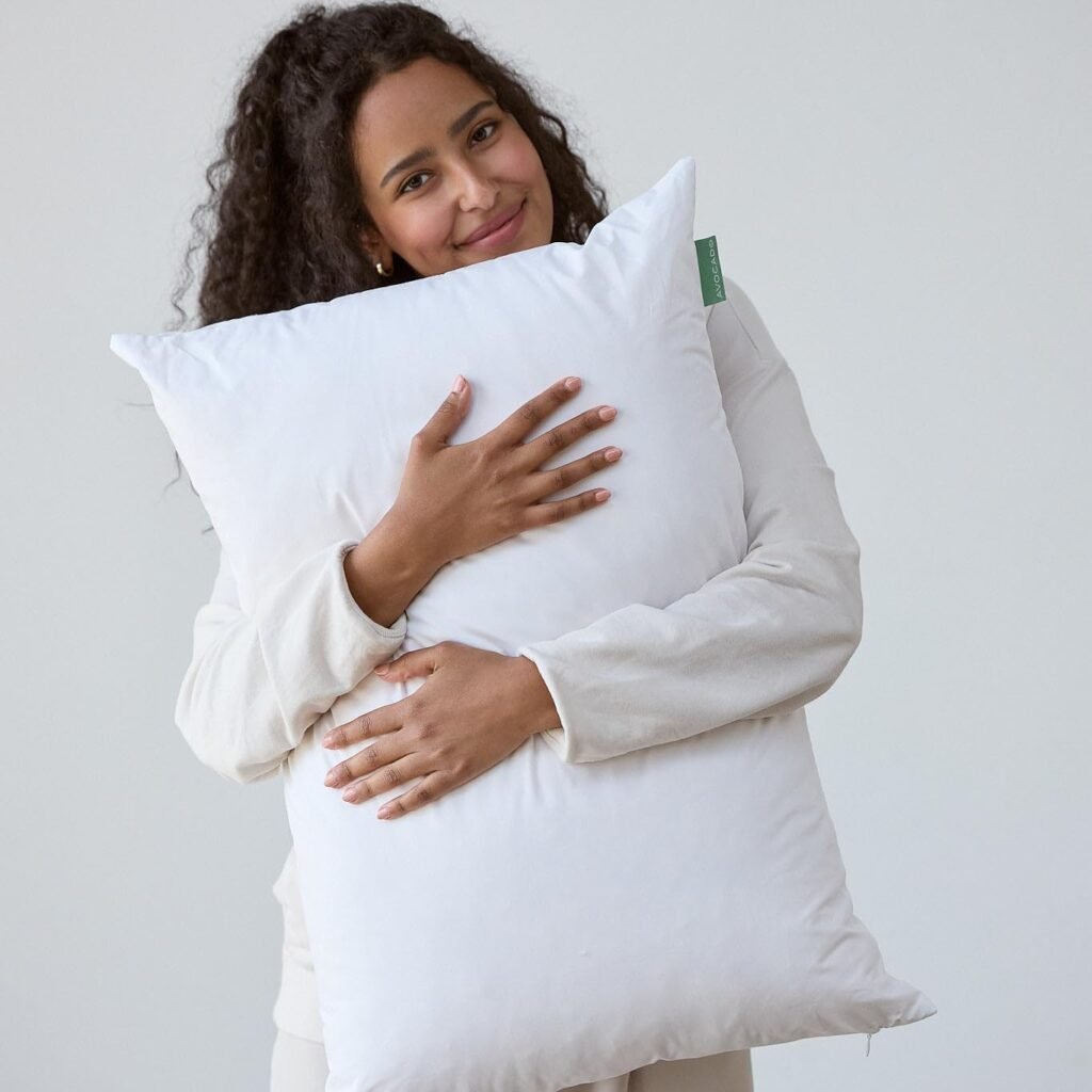 Woman holding organic cotton Avocado pillow
