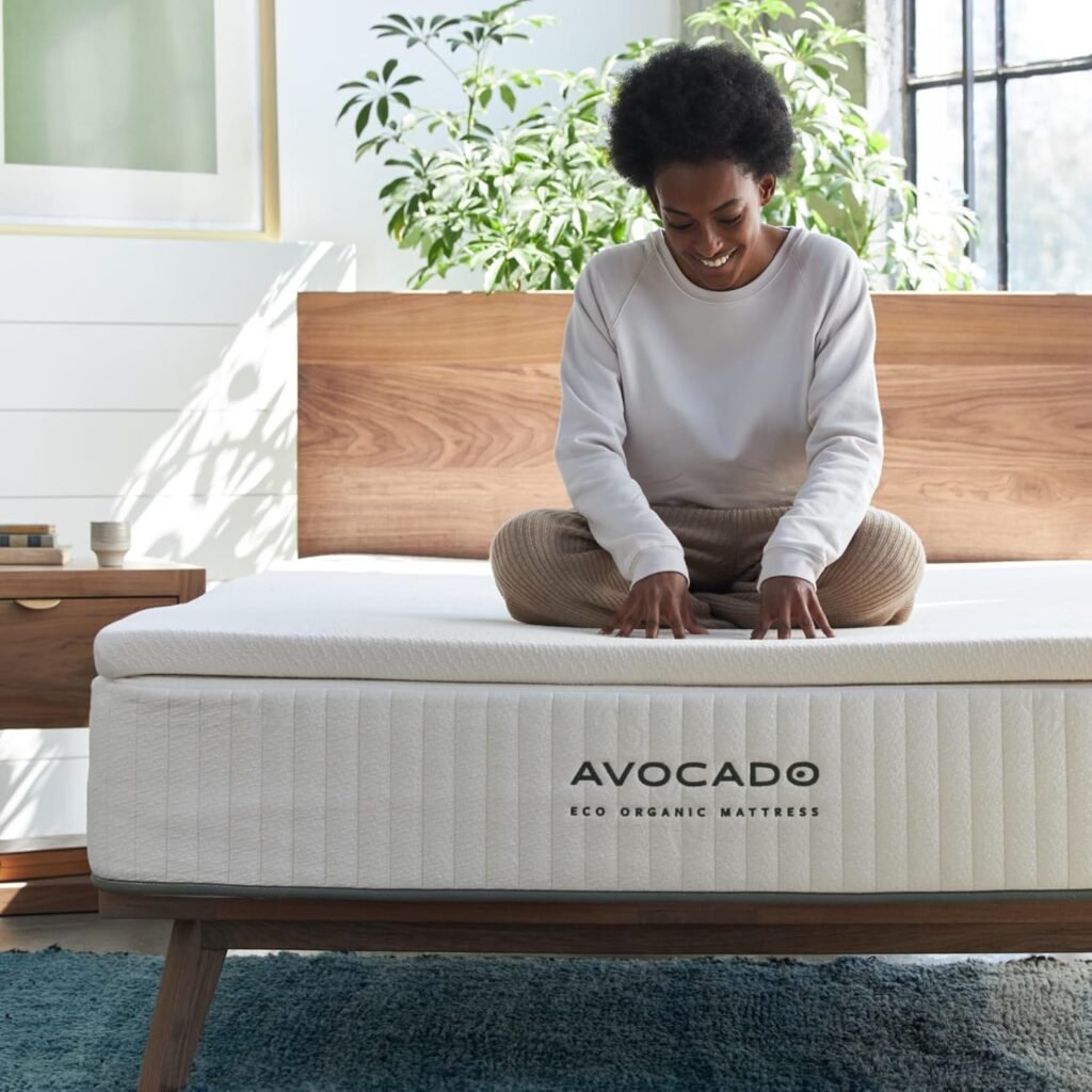 Person sitting on Avocado Eco Organic latex topper