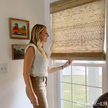 Woman adjusting sustainable woven bamboo blinds