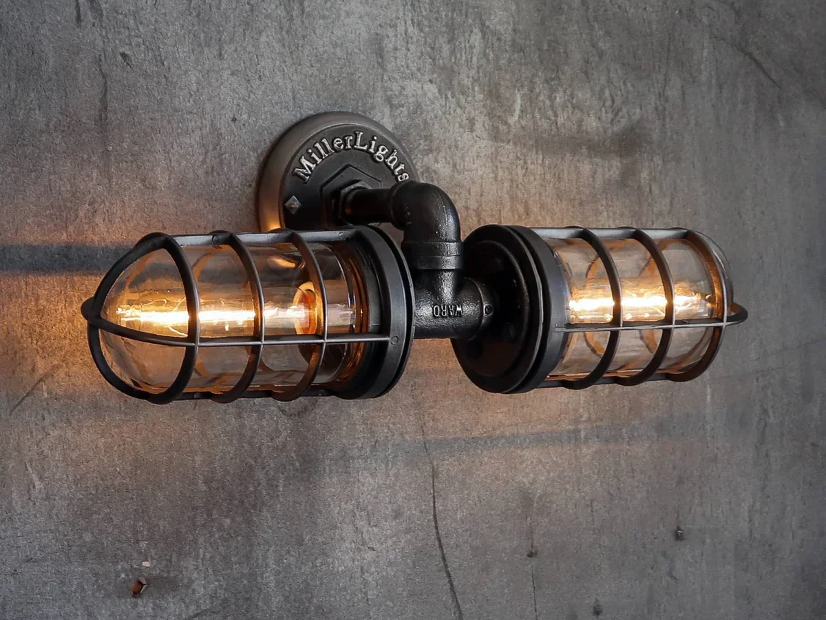 Industrial-style bathroom vanity light with cage design