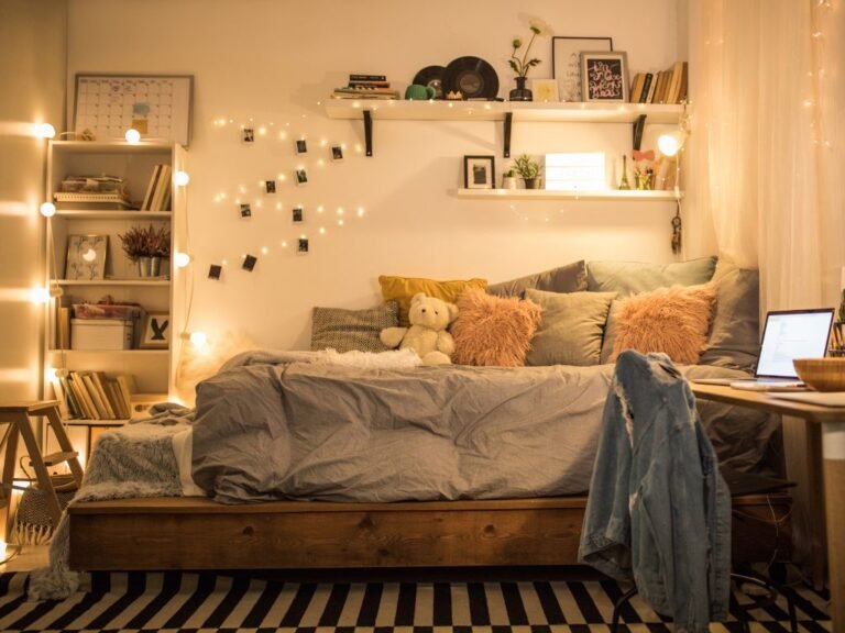 Warm bedroom with string lights and autumn pillows